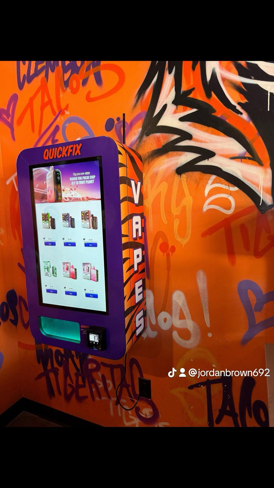 Slim wall vending machine wrapped with Clemson artwork in Clemson, SC